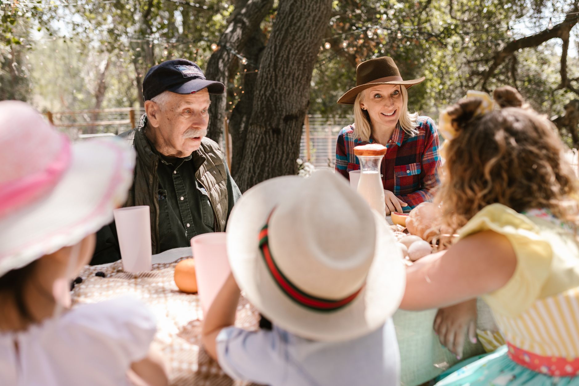 A family gathered around a table in conversation