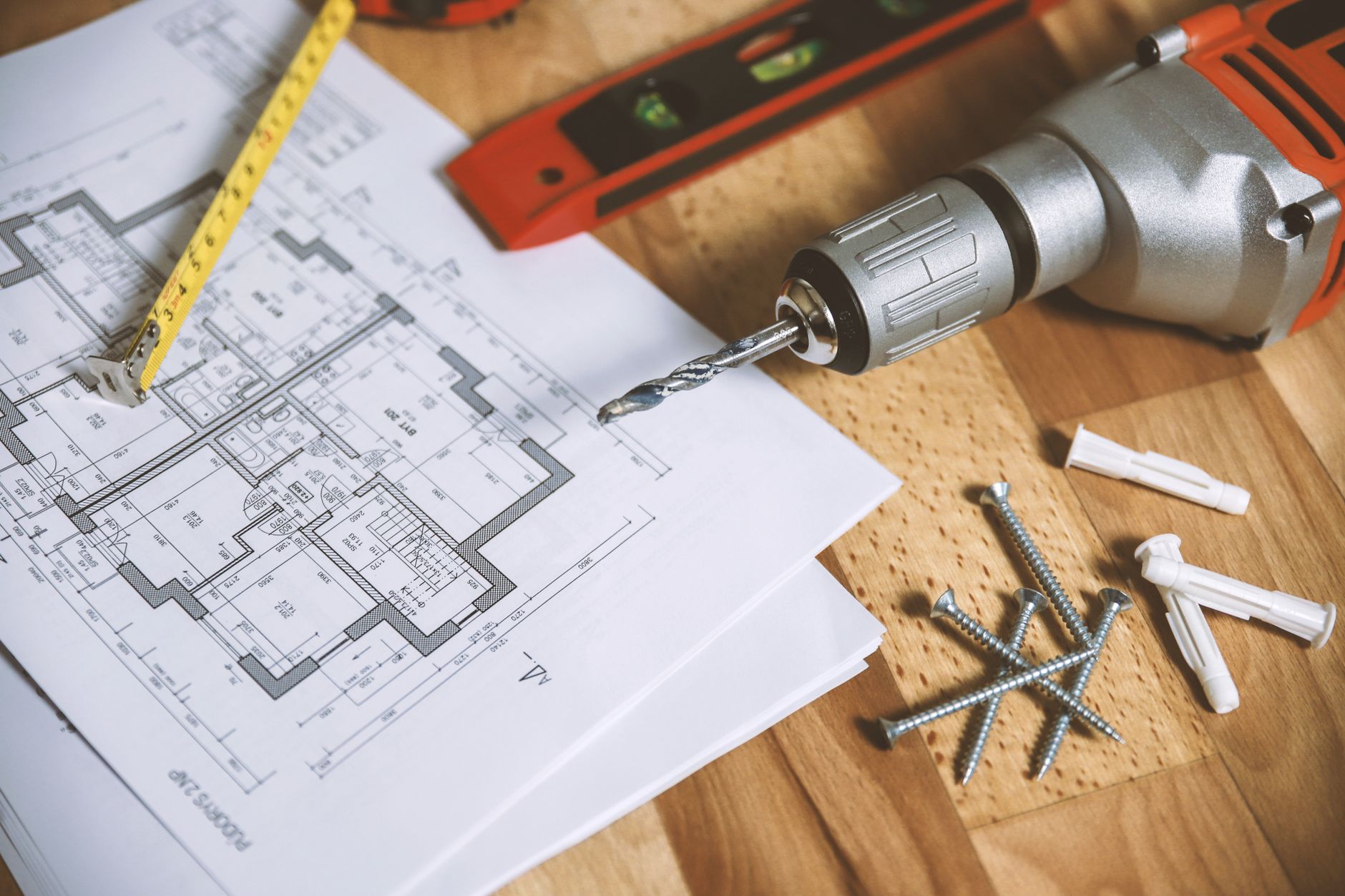 Blueprints and tools laid out for a home renovation project