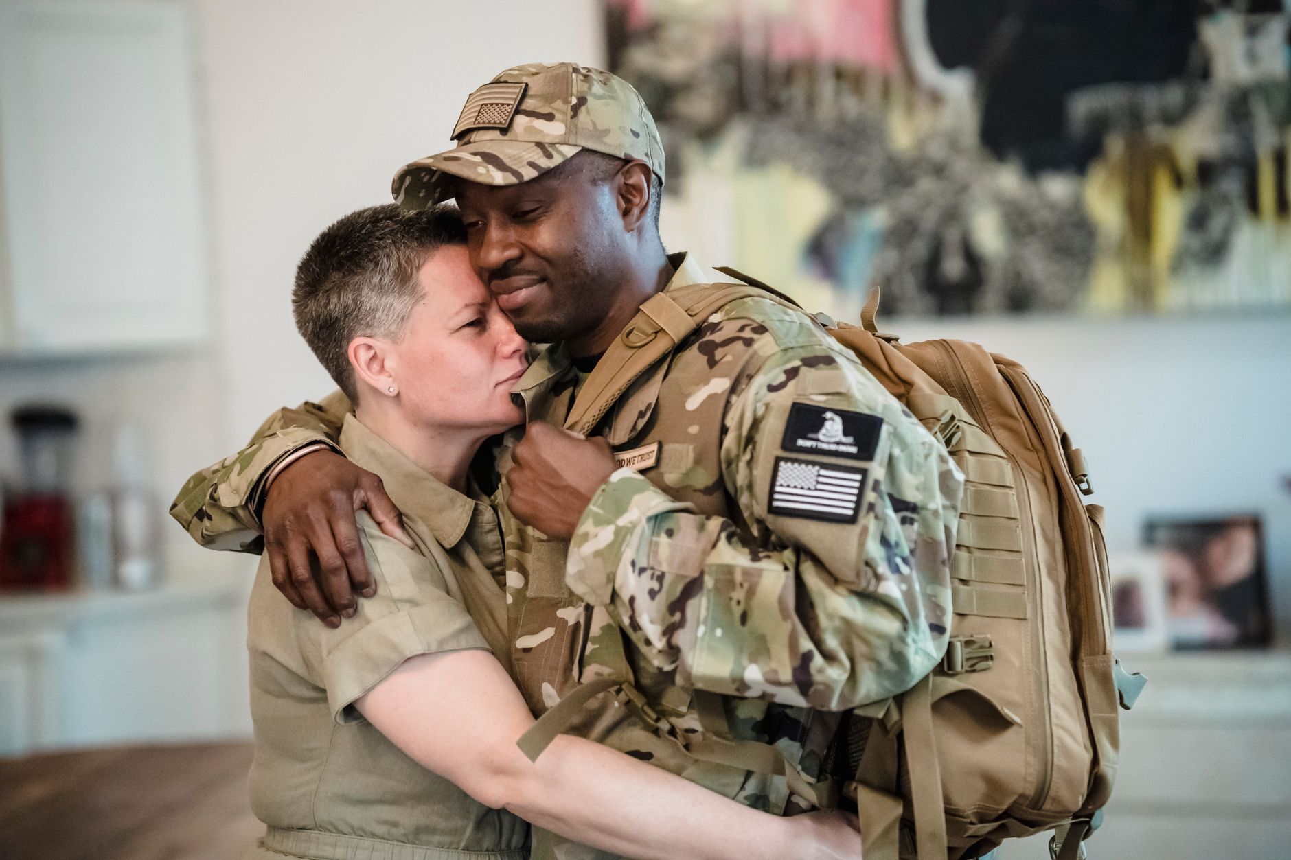 A military service member embracing a family member