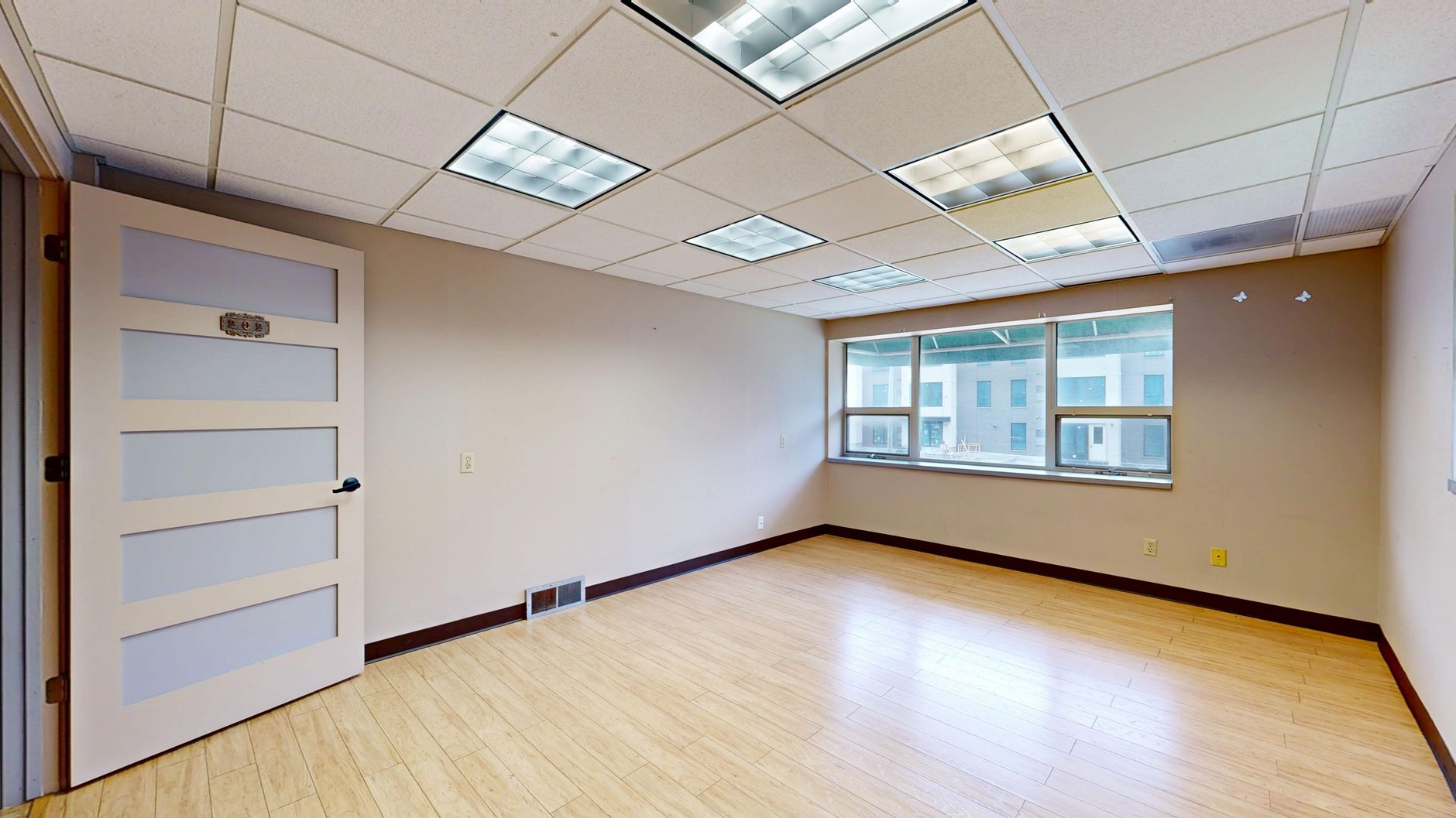 An empty commercial office space available for lease