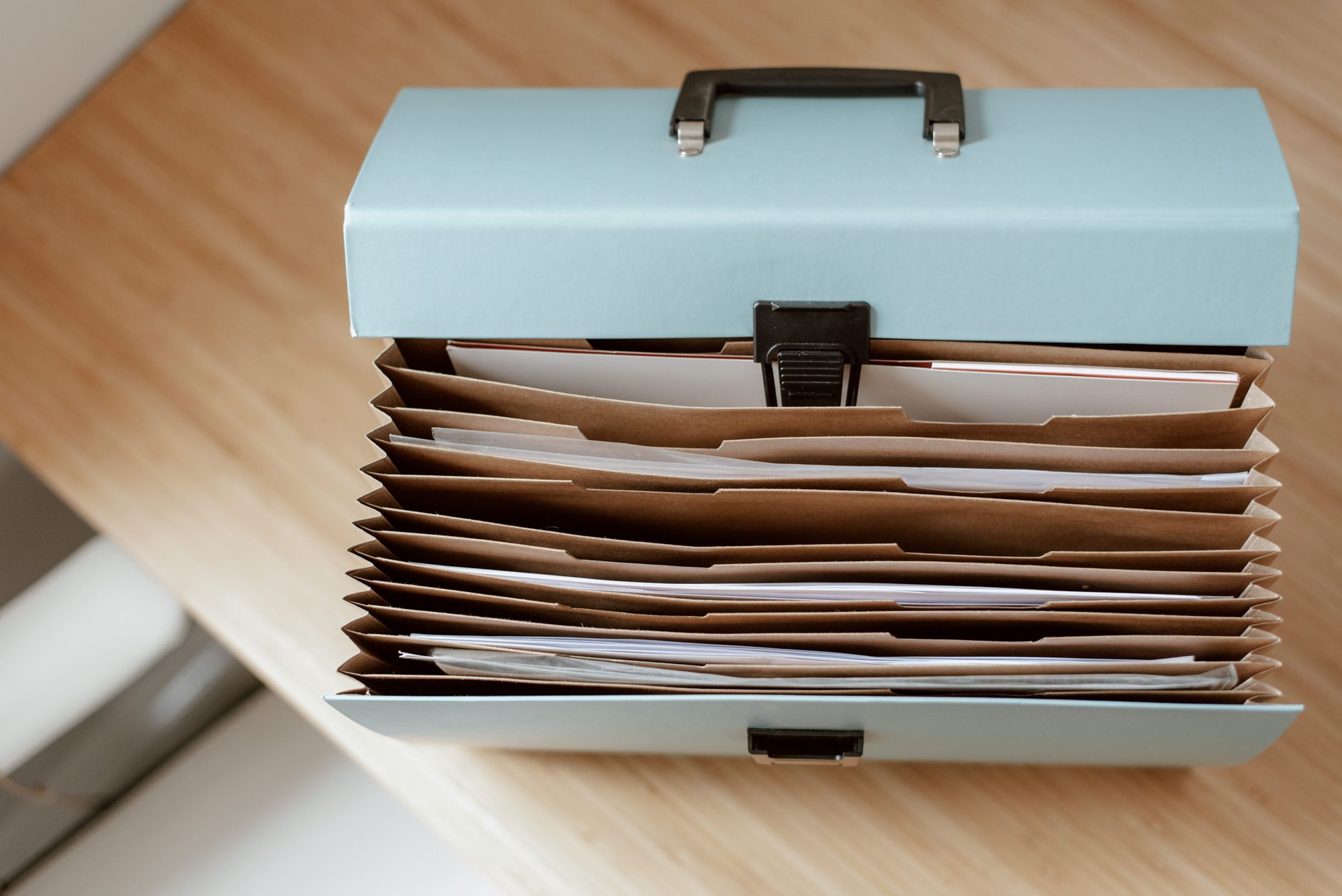 Organized file folders and documents on a desk