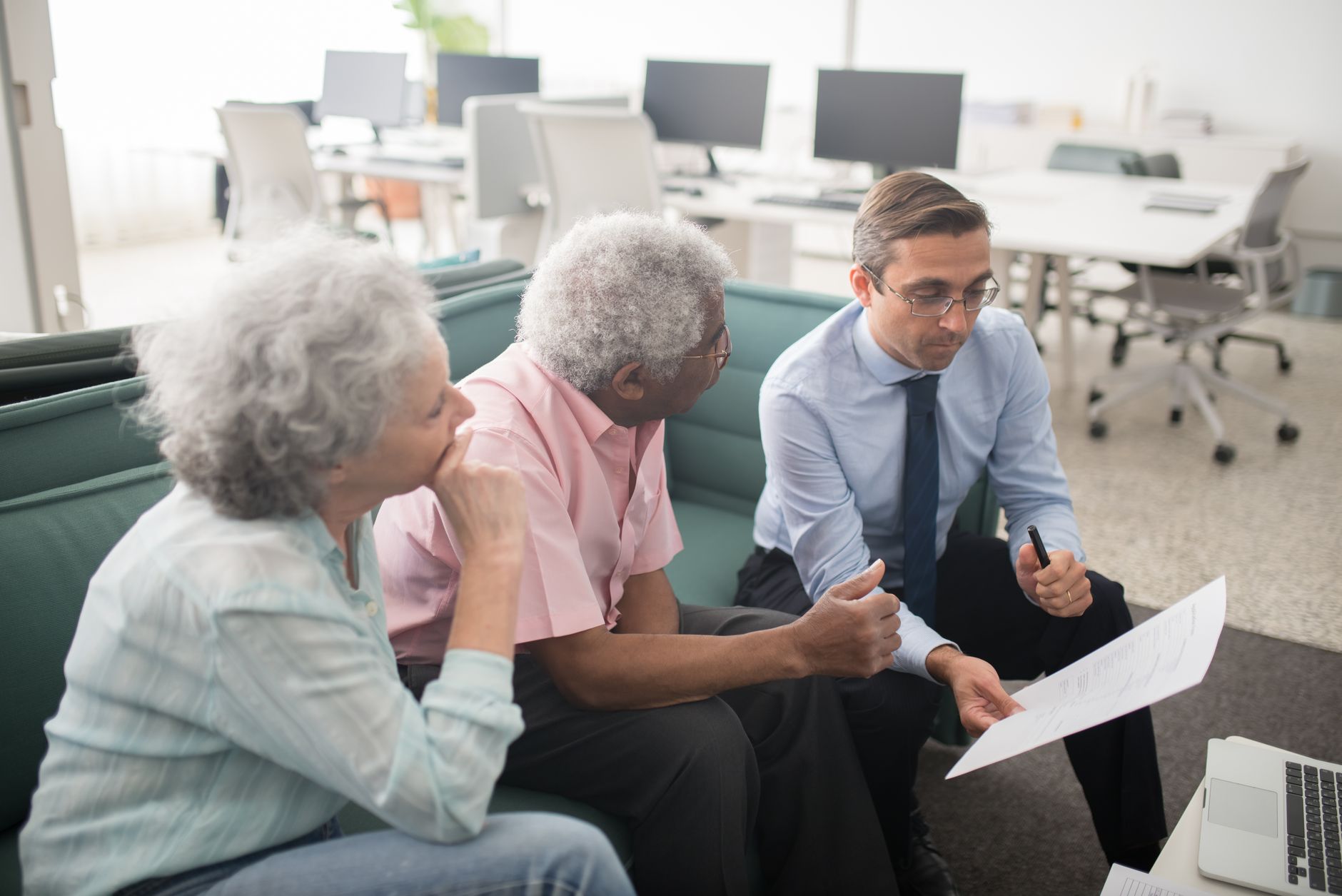 A senior couple in a consultation with an advisor