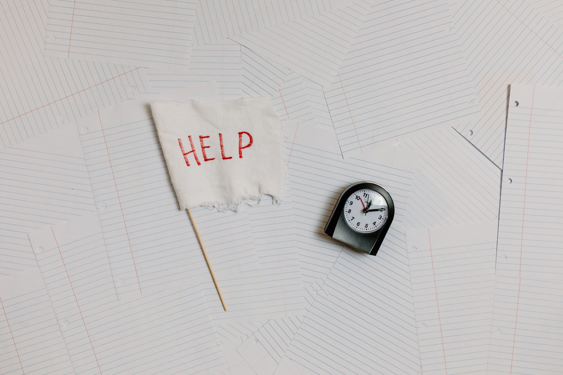 A clock on a desk suggesting a tight timeline