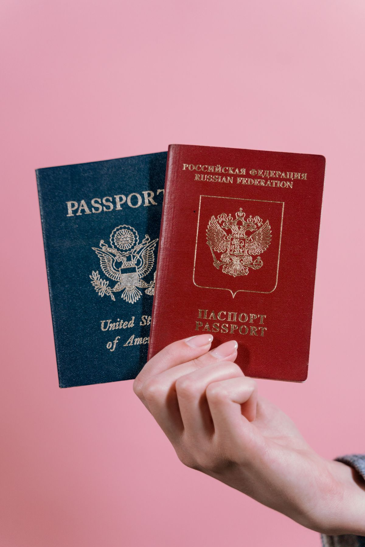 A passport and travel documents laid out on a table